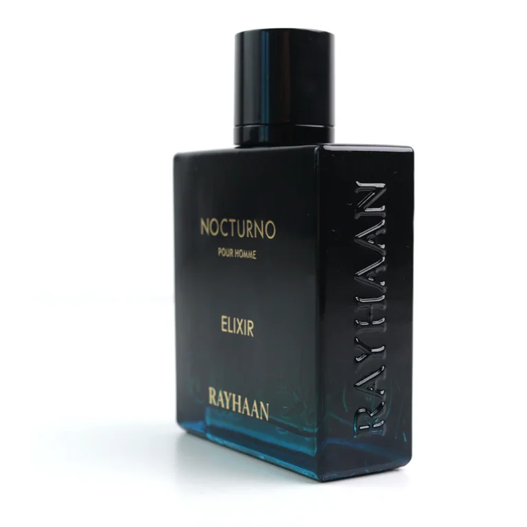 Rayhaan Nocturno Elixir perfume with minimal mint leaves and sandalwood placed strictly behind the bottle.