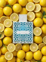 Rayhaan Azul perfume with minimal fresh lemon and sandalwood placed strictly behind the bottle.