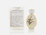 Khadlaj Sawaar Vanille Blanc perfume with minimal vanilla beans artistically arranged exclusively on the left and right sides of the bottle.
