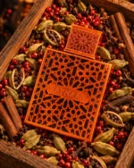 Rayhaan Vantage perfume with minimal cardamom pods and cedarwood artistically arranged exclusively on the left and right sides of the bottle.
